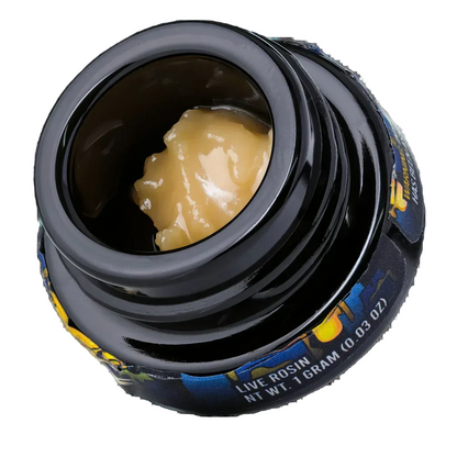 Black jar of live hash rosin concentrate, 1 gram, creamy yellow color, close-up